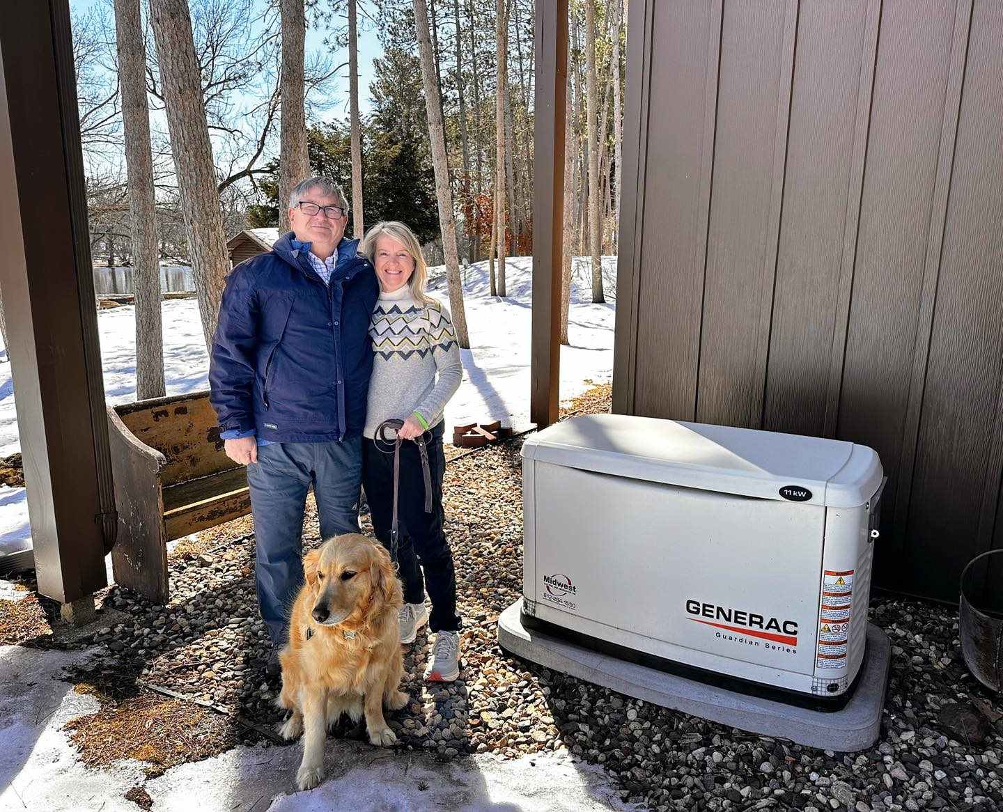Couple with Dog Next to Generac Generator